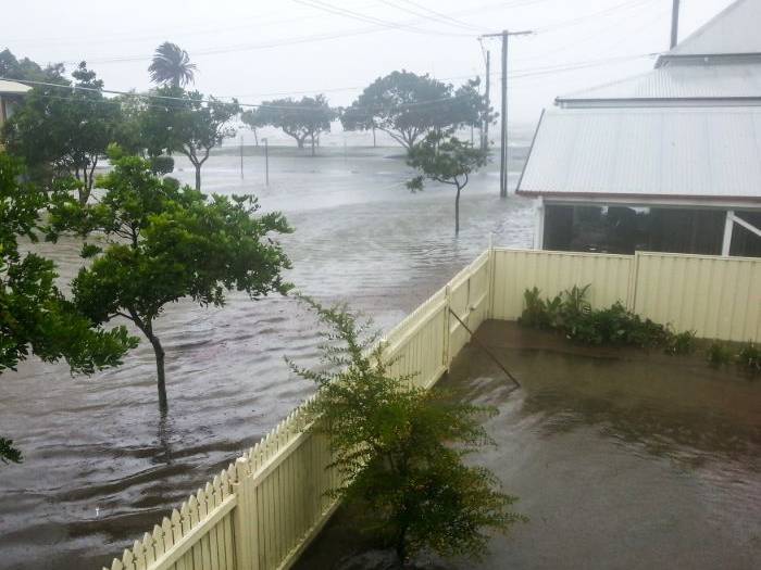 Flood water surrounding a home after a storm