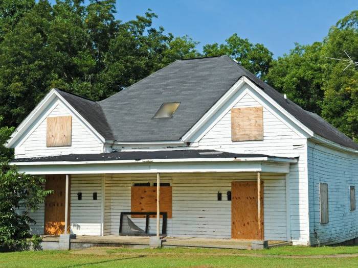 Boarded-up house awaiting restoration