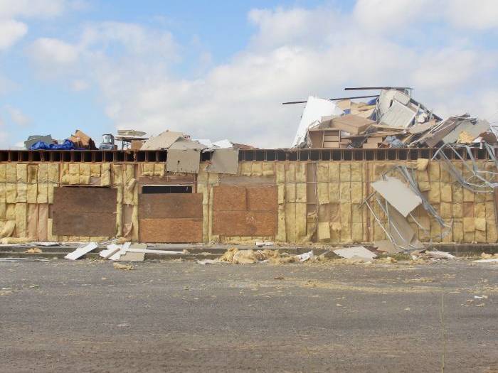 claims adjuster inspecting property damage