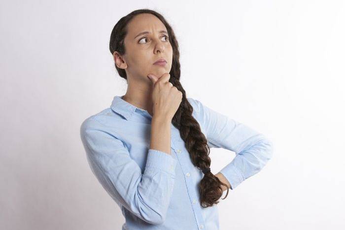 Woman weighing a question
